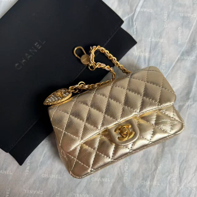 CC CLASSIC FLAP BAG 13 IN GOLD LAMBSKIN WITH PEARL HEART CHARM