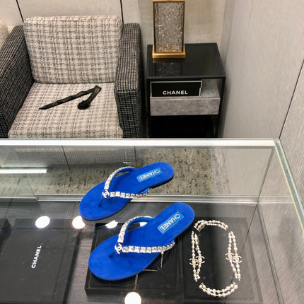 THONG SLIDE IN COBALT BLUE SUEDE WITH WHITE CRYSTALS