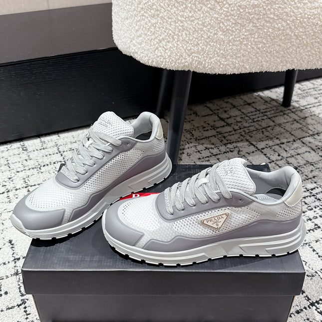PRADA 25S MEN SNEAKERS IN GRAY AND WHITE CANVAS