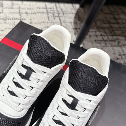 PRADA 25S MEN SNEAKERS IN BLACK AND WHITE CANVAS