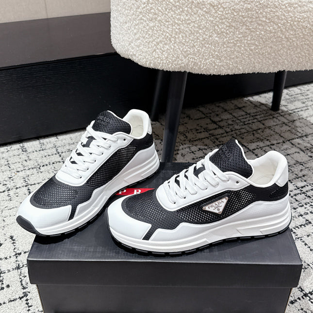 PRADA 25S MEN SNEAKERS IN BLACK AND WHITE CANVAS