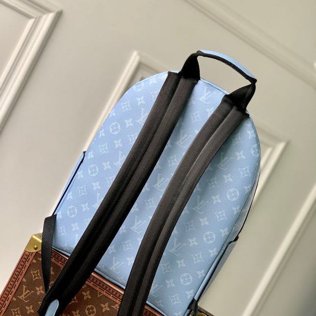 DISCOVERY SLIM BACKPACK 38 BLUE MONOGRAM COATED CANVAS AND CALFSKIN