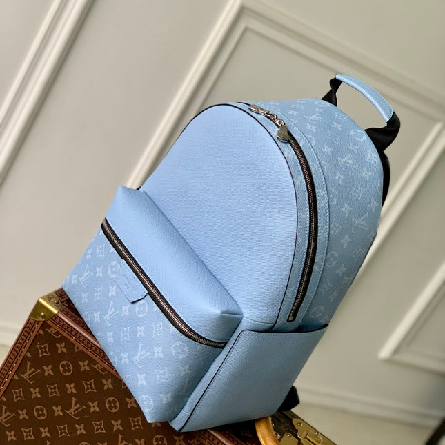 DISCOVERY SLIM BACKPACK 38 BLUE MONOGRAM COATED CANVAS AND CALFSKIN