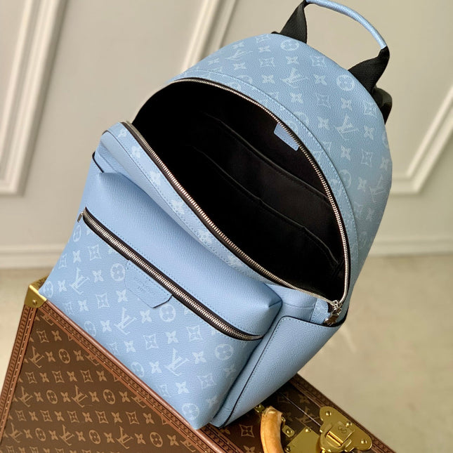 DISCOVERY SLIM BACKPACK 38 BLUE MONOGRAM COATED CANVAS AND CALFSKIN