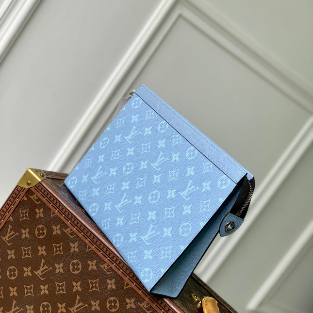 POCHETTE VOYAGE 26 IN LIGHT BLUE MONOGRAM ECLIPSE CALFSKIN