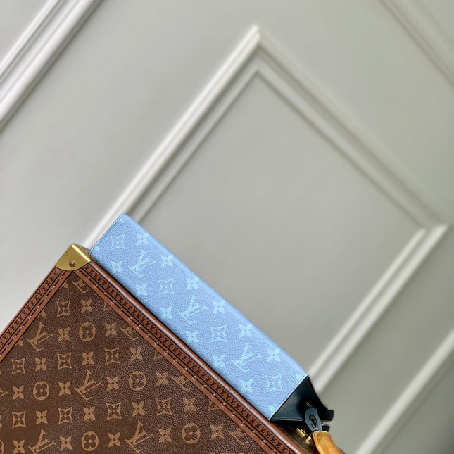 POCHETTE VOYAGE 26 IN LIGHT BLUE MONOGRAM ECLIPSE CALFSKIN