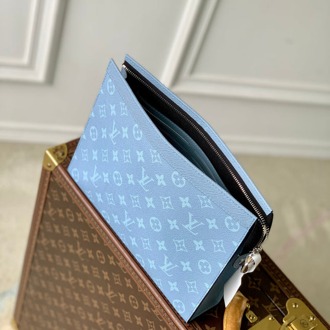 POCHETTE VOYAGE 26 IN LIGHT BLUE MONOGRAM ECLIPSE CALFSKIN