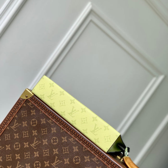 POCHETTE VOYAGE 26 IN LEMON YELLOW MONOGRAM ECLIPSE CALFSKIN