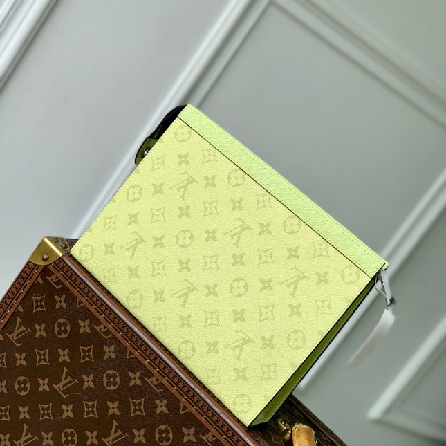 POCHETTE VOYAGE 26 IN LEMON YELLOW MONOGRAM ECLIPSE CALFSKIN