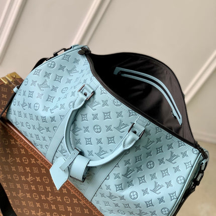KEEPALL BANDOULIÈRE 50 IN SKY BLUE MONOGRAM SHADOW EMBOSSED CALFSKIN