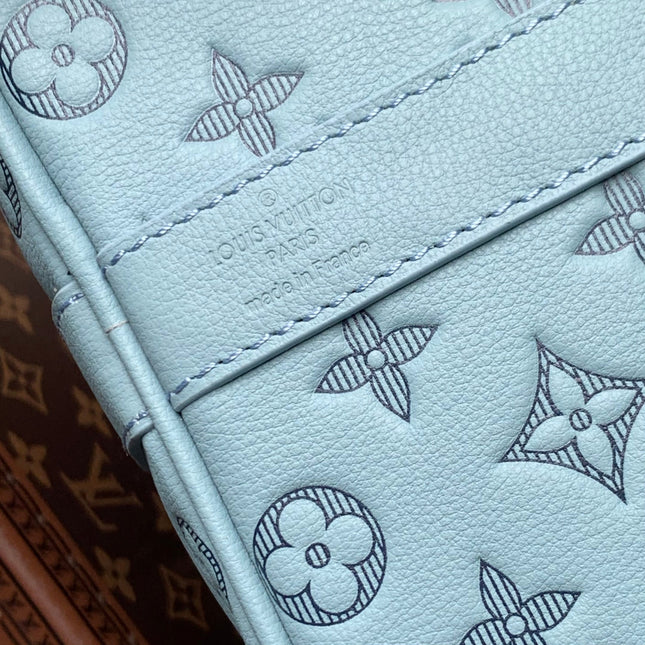 KEEPALL BANDOULIÈRE 50 IN SKY BLUE MONOGRAM SHADOW EMBOSSED CALFSKIN