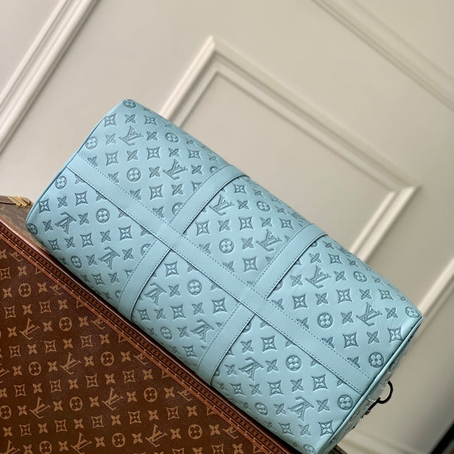 KEEPALL BANDOULIÈRE 50 IN SKY BLUE MONOGRAM SHADOW EMBOSSED CALFSKIN