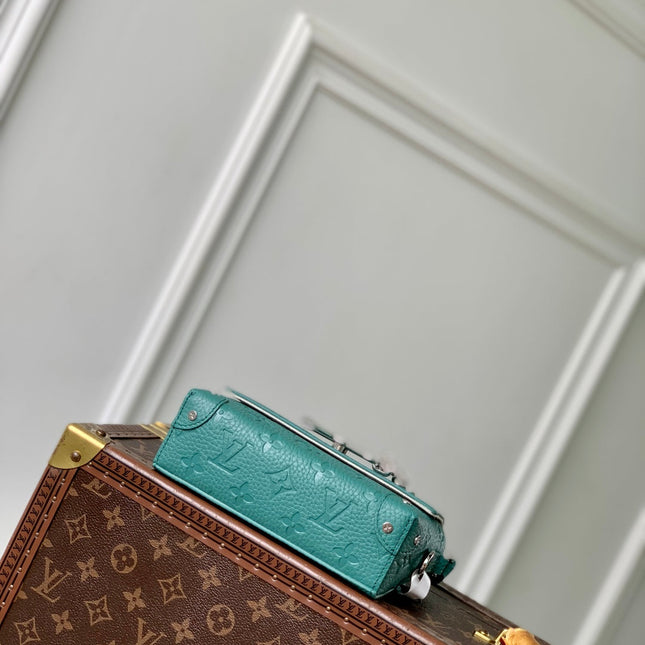 STEAMER WEARABLE WALLET 18 IN TEAL GREEN MONOGRAM TAURILLON CALFSKIN