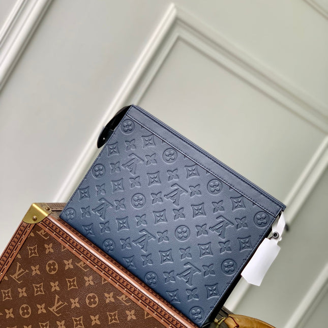 POCHETTE VOYAGE 27 IN DARK BLUE MONOGRAM ECLIPSE CALFSKIN EMBOSSED LOGO