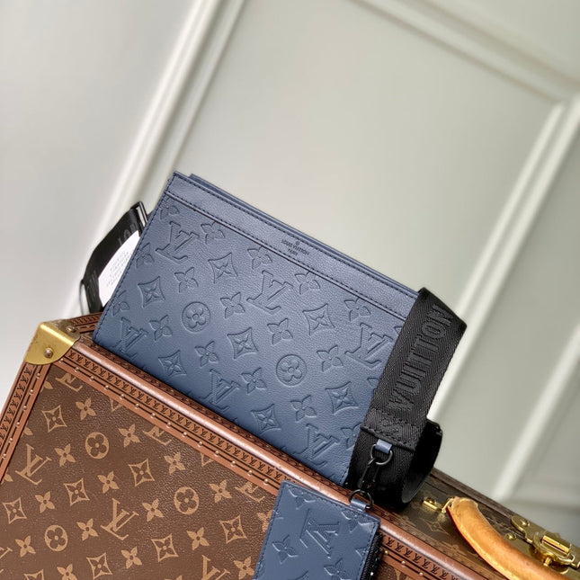 POCHETTE VOYAGE 22 IN DARK BLUE MONOGRAM SHADOW CALFSKIN