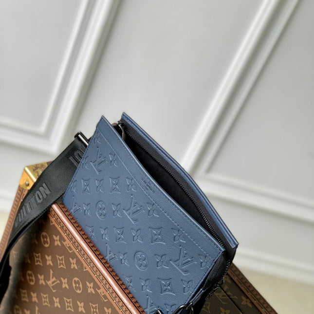 POCHETTE VOYAGE 22 IN DARK BLUE MONOGRAM SHADOW CALFSKIN