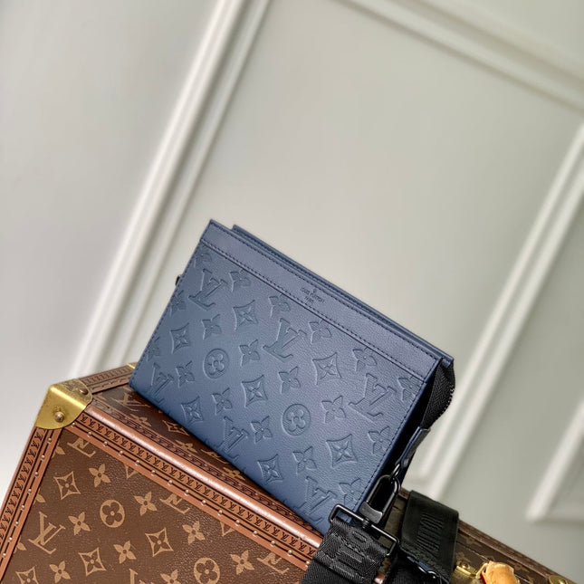POCHETTE VOYAGE 22 IN DARK BLUE MONOGRAM SHADOW CALFSKIN