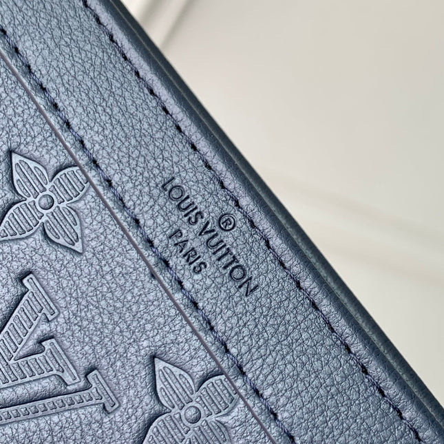 POCHETTE VOYAGE 22 IN DARK BLUE MONOGRAM SHADOW CALFSKIN