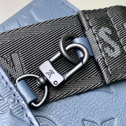 POCHETTE VOYAGE 22 IN DARK BLUE MONOGRAM SHADOW CALFSKIN