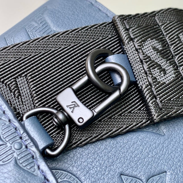 POCHETTE VOYAGE 22 IN DARK BLUE MONOGRAM SHADOW CALFSKIN