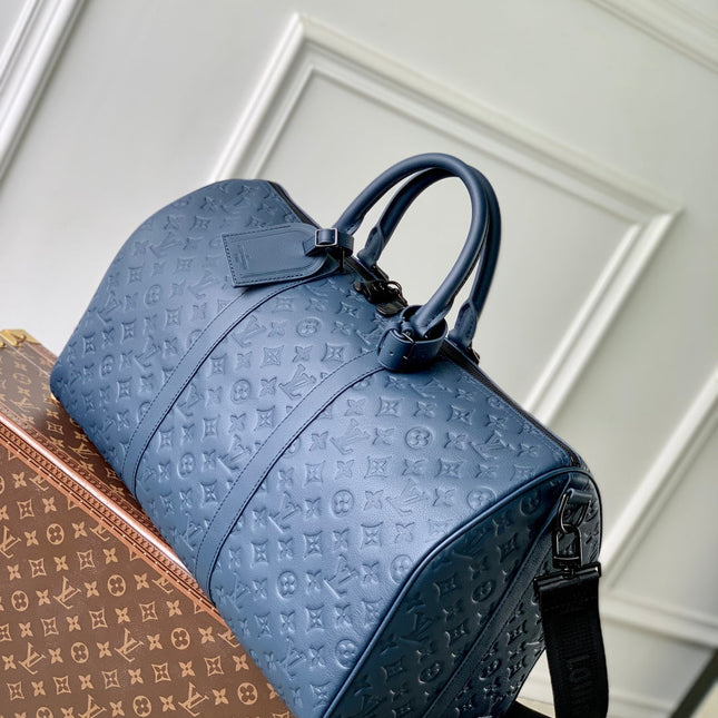 KEEPALL BANDOULIÈRE 50 IN DARK BLUE MONOGRAM SHADOW EMBOSSED CALFSKIN