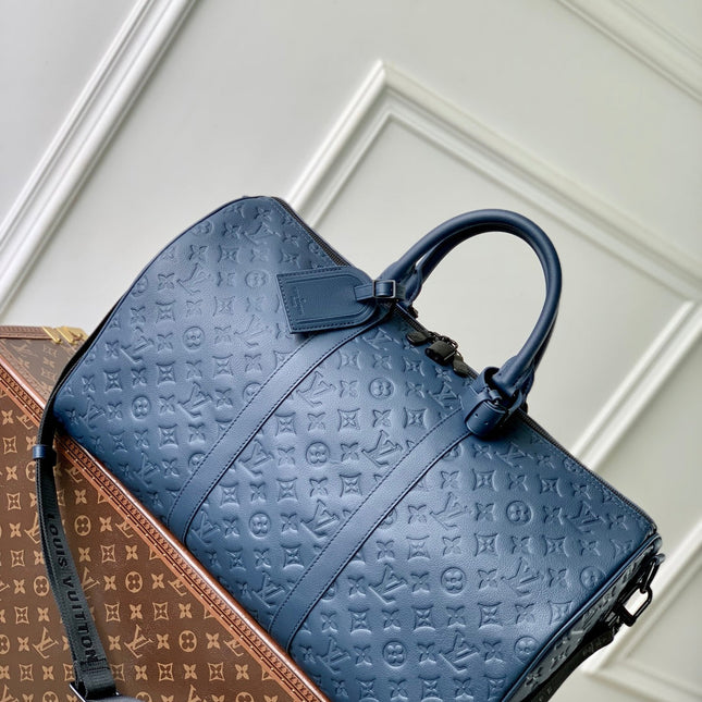 KEEPALL BANDOULIÈRE 50 IN DARK BLUE MONOGRAM SHADOW EMBOSSED CALFSKIN