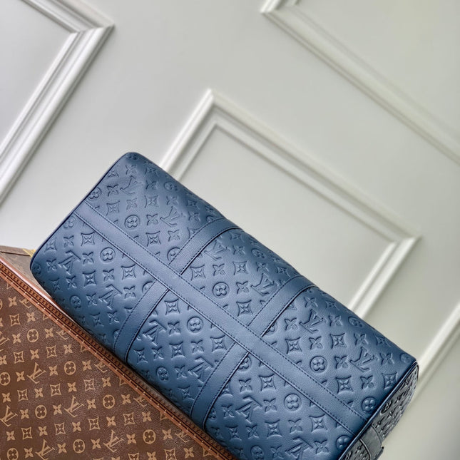 KEEPALL BANDOULIÈRE 50 IN DARK BLUE MONOGRAM SHADOW EMBOSSED CALFSKIN