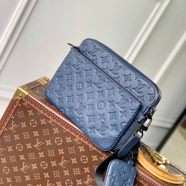 TRIO MESSENGER 25 IN BLUE MONOGRAM SHADOW CALFSKIN