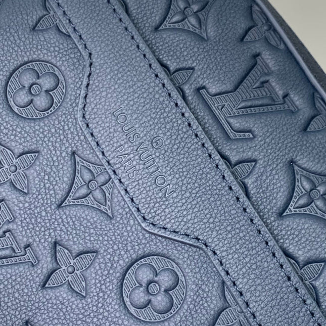 TRIO MESSENGER 25 IN BLUE MONOGRAM SHADOW CALFSKIN