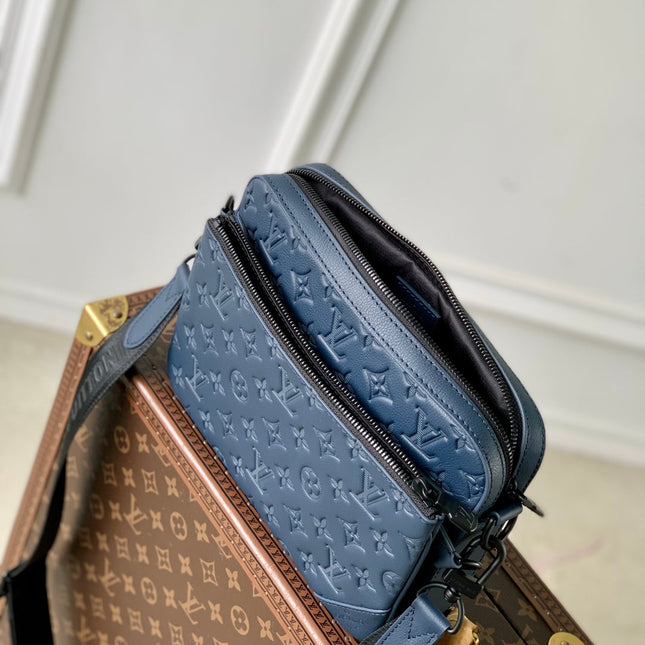 TRIO MESSENGER 25 IN BLUE MONOGRAM SHADOW CALFSKIN