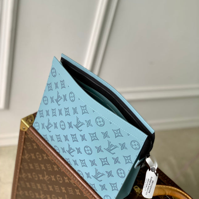 POCHETTE VOYAGE 26 IN SKY BLUE MONOGRAM ECLIPSE CALFSKIN