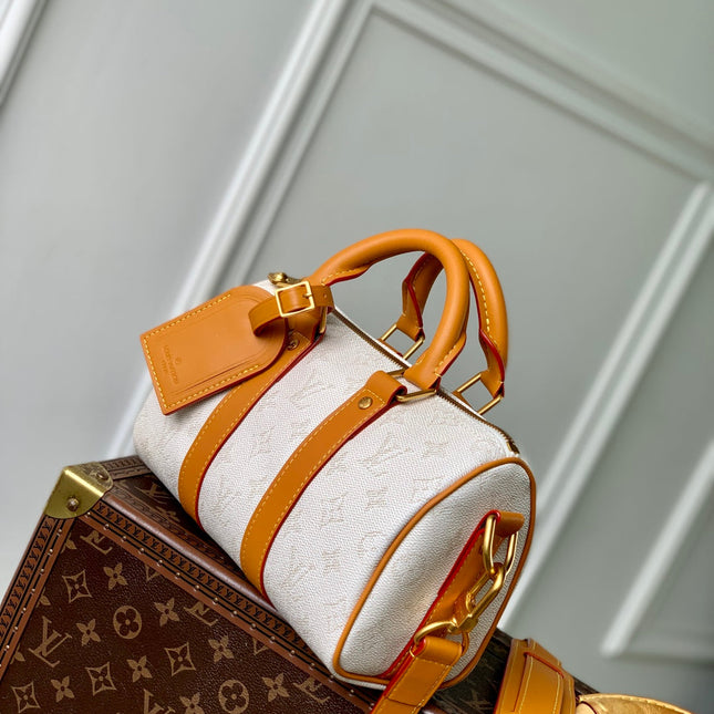 KEEPALL BANDOULIÈRE 25 IN WHITE MONOGRAM HERITAGE CANVAS BRWON CALFSKIN