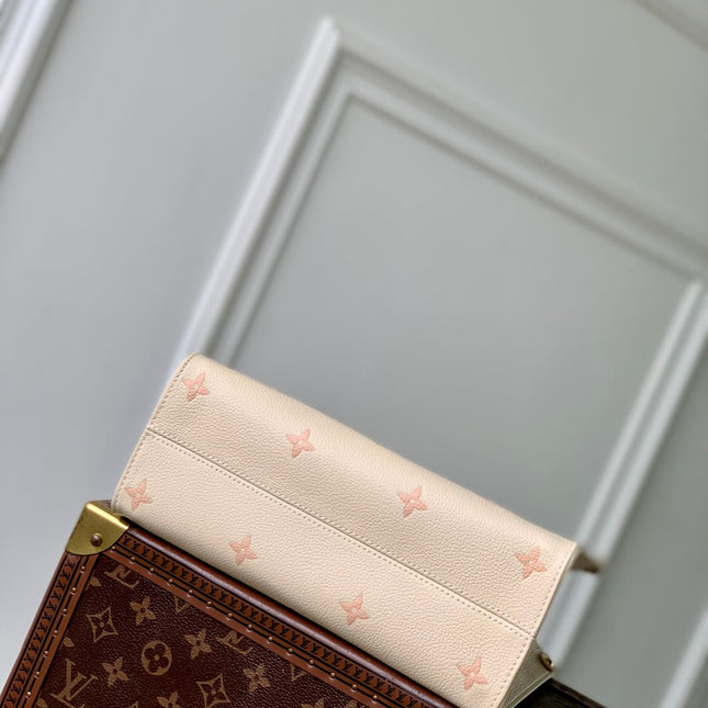 ONTHEGO 25 IN CREAM MONOGRAM EMPREINTE CALFSKIN EMBOSSED LOGO