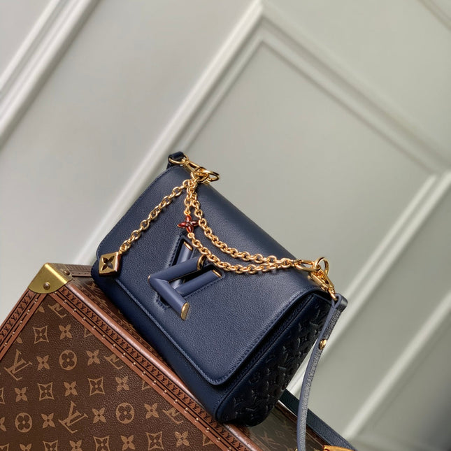 TWIST SLIM 19 IN NAVY BLUE TAURILLON CALFSKIN GOLD HARDWARE