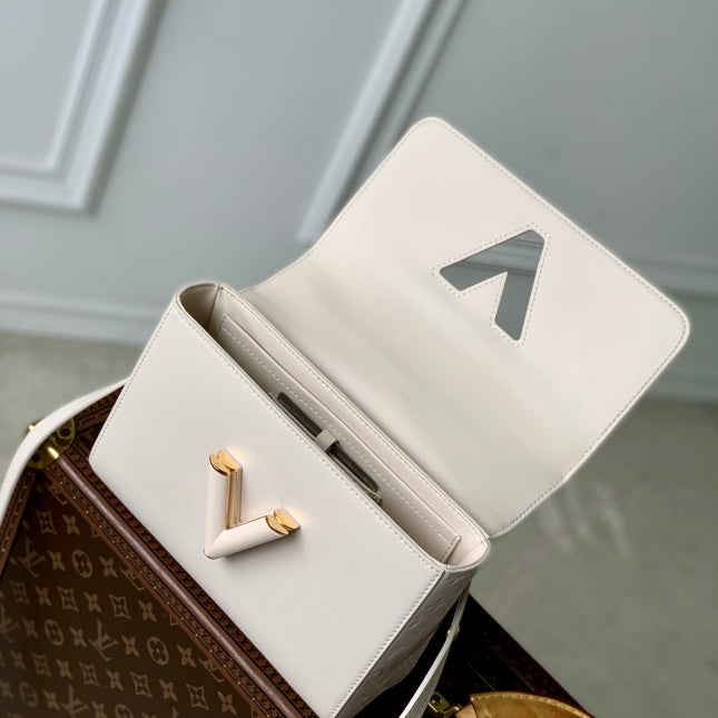 TWIST SLIM 19 IN LIGHT PINK TAURILLON CALFSKIN GOLD HARDWARE