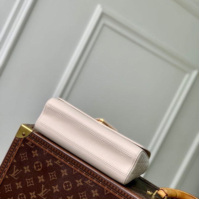 TWIST SLIM 19 IN LIGHT PINK TAURILLON CALFSKIN GOLD HARDWARE