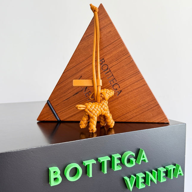 BOTTEGA VENETA 25S DOG CHARM IN BURNT ORANGE CALFSKIN