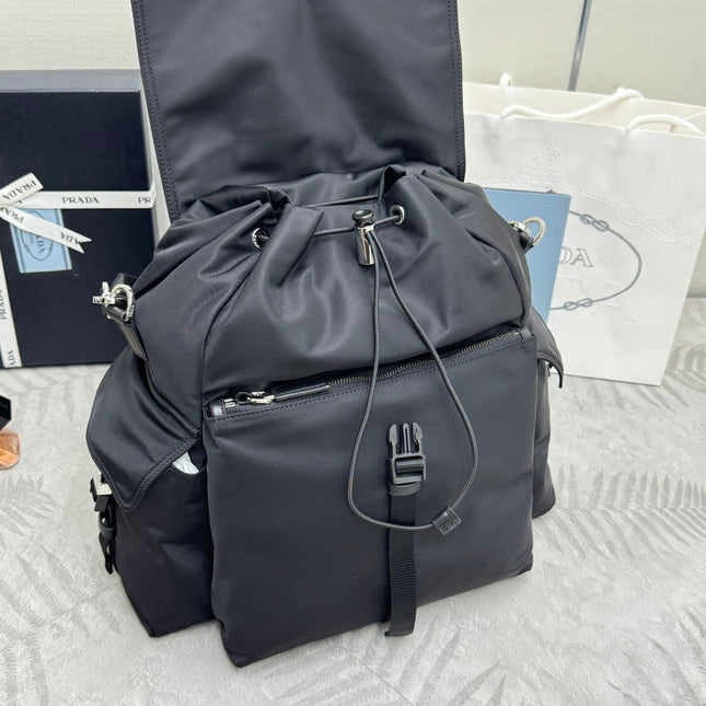 PRADA 25S EXPLORE BACKPACK 39 IN BLACK RE-NYLON AND CALFSKIN