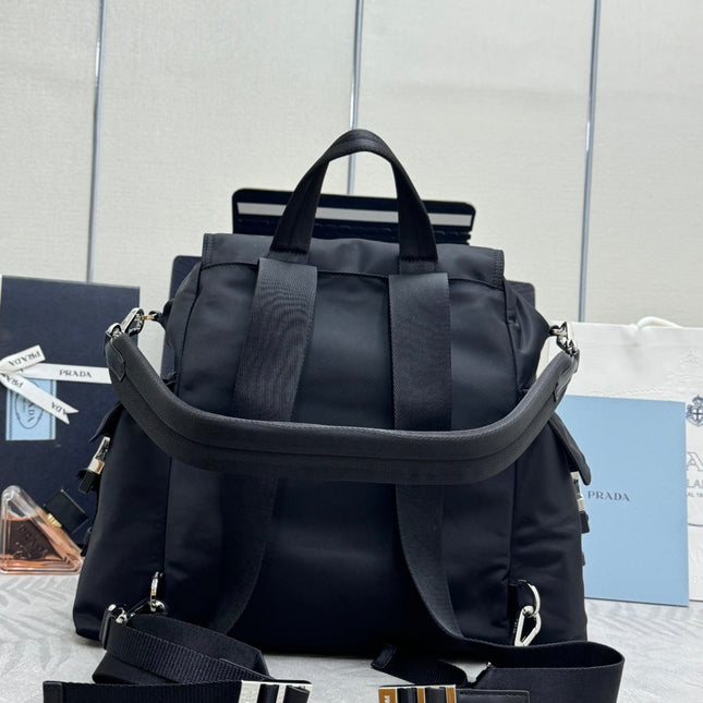 PRADA 25S EXPLORE BACKPACK 39 IN BLACK RE-NYLON AND CALFSKIN