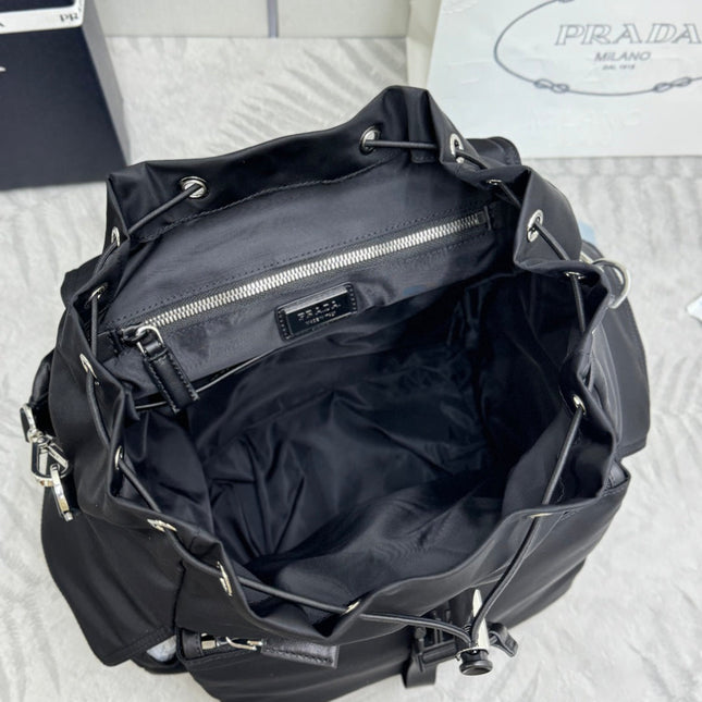 PRADA 25S EXPLORE BACKPACK 39 IN BLACK RE-NYLON AND CALFSKIN