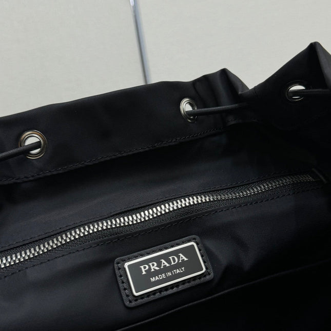 PRADA 25S EXPLORE BACKPACK 39 IN BLACK RE-NYLON AND CALFSKIN