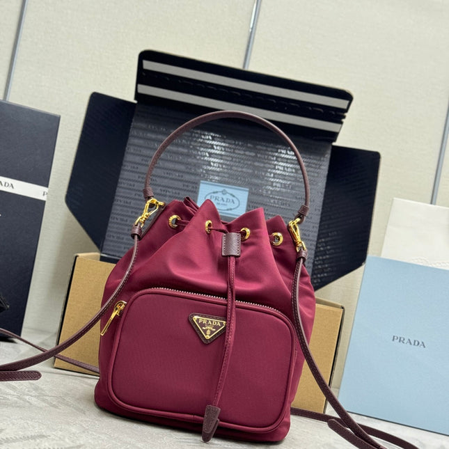 PRADA 25S DUET BUCKET BAG 23 IN BURGUNDY RE-NYLON GOLD HARDWRE