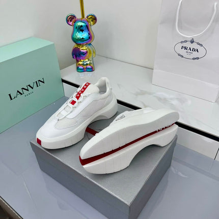 PRADA 25S CROSS LACED SNEAKERS IN WHITE CALFSKIN