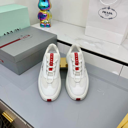 PRADA 25S CROSS LACED SNEAKERS IN WHITE CALFSKIN