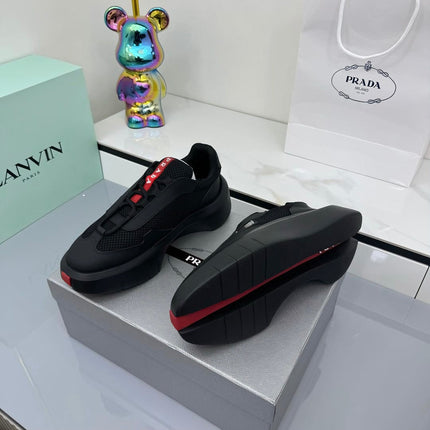 PRADA 25S CROSS LACED SNEAKERS IN BLACK CALFSKIN