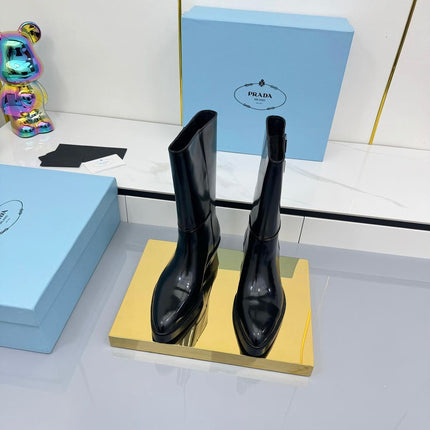 PRADA 25S BROOKLYN BOOTS 50MM IN BLACK GLOSSY CALFSKIN WITH LOGO