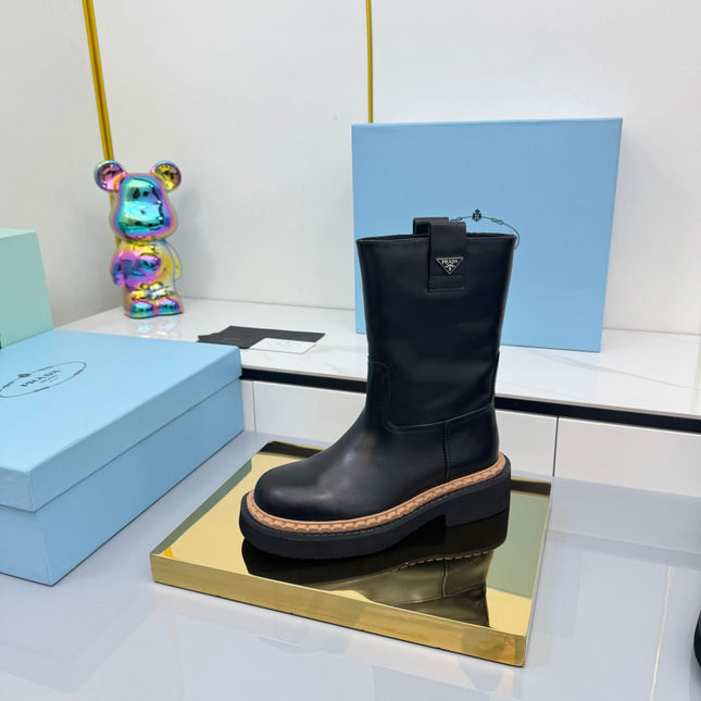 PRADA 25S HIGH MARTIN BOOTS 50MM IN BLACK CALFSKIN