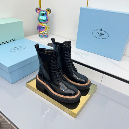 PRADA 25S LONG THICK SOLED MARTIN BOOTS 50MM IN BLACK GLOSSY CALFSKIN