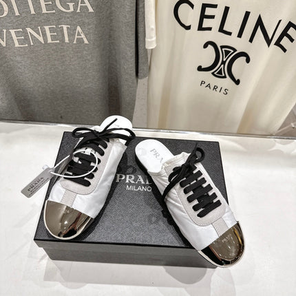PRADA 25S MULES IN WHITE WITH METAL TOECAP