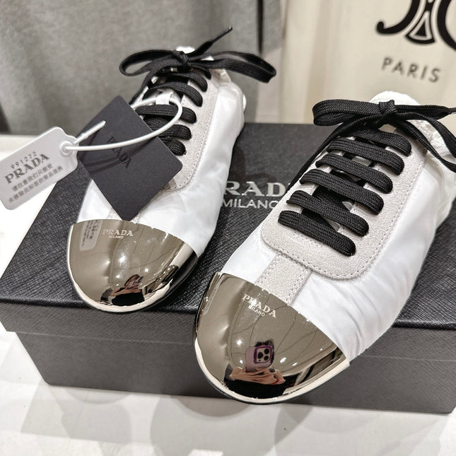 PRADA 25S MULES IN WHITE WITH METAL TOECAP